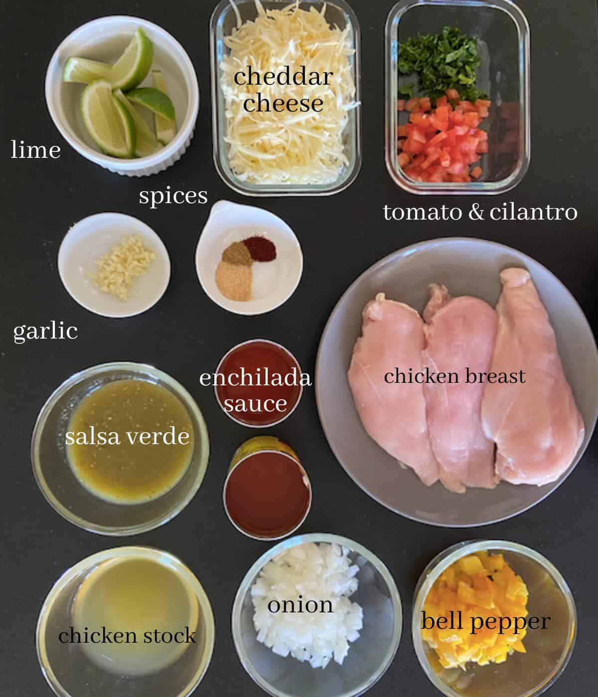 chicken enchilada ingredients with text on black countertop