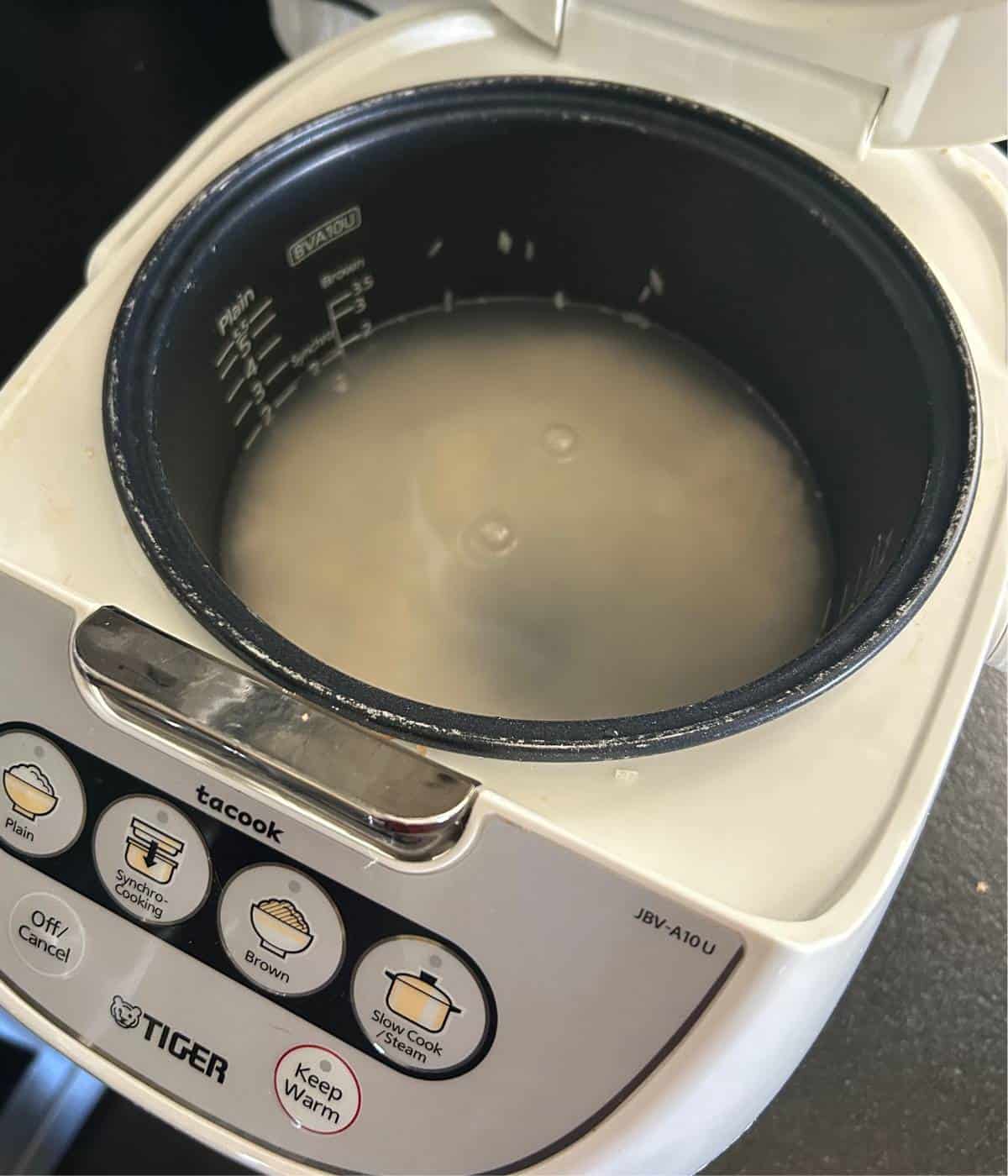 Cooking rice in rice cooker.