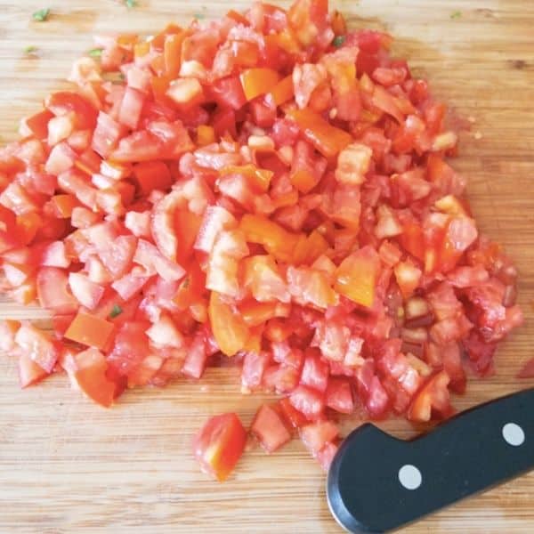 diced tomatoes on a cutting board