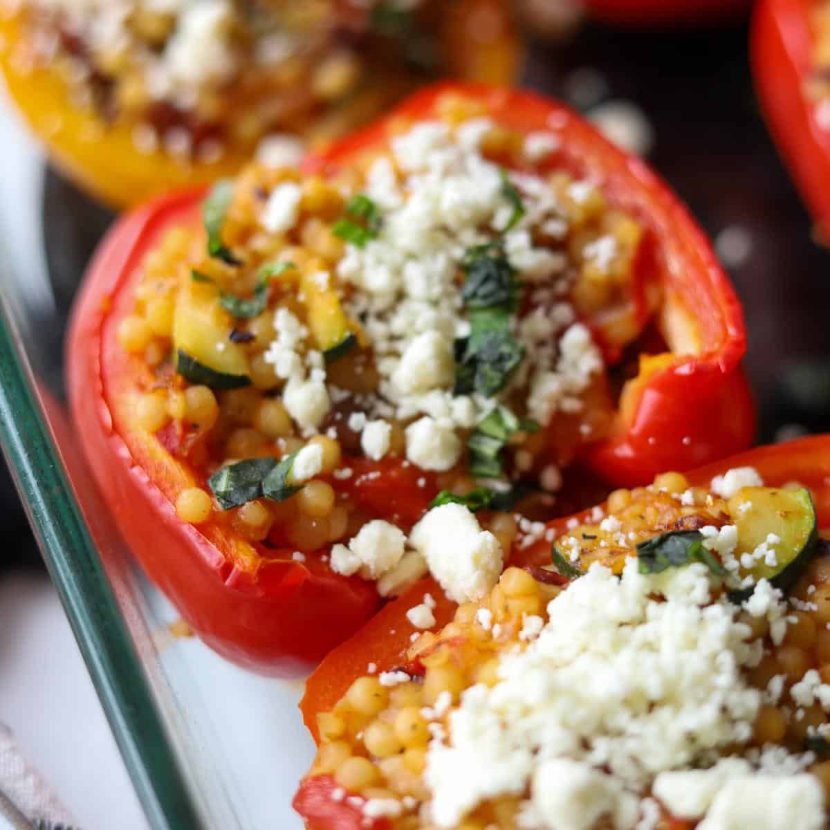 close up of red bell pepper stuffed with couscous filling