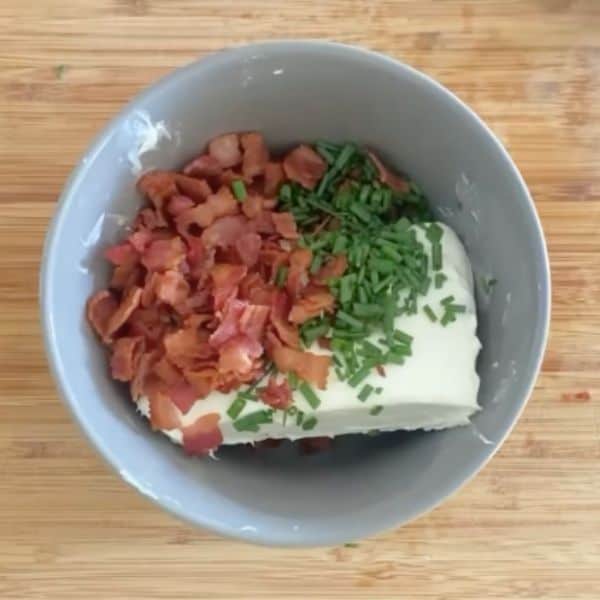 cream cheese, bacon, salt and pepper and chives in a bowl