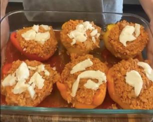 turkey stuffed peppers with cheese ready for the oven in casserole dish