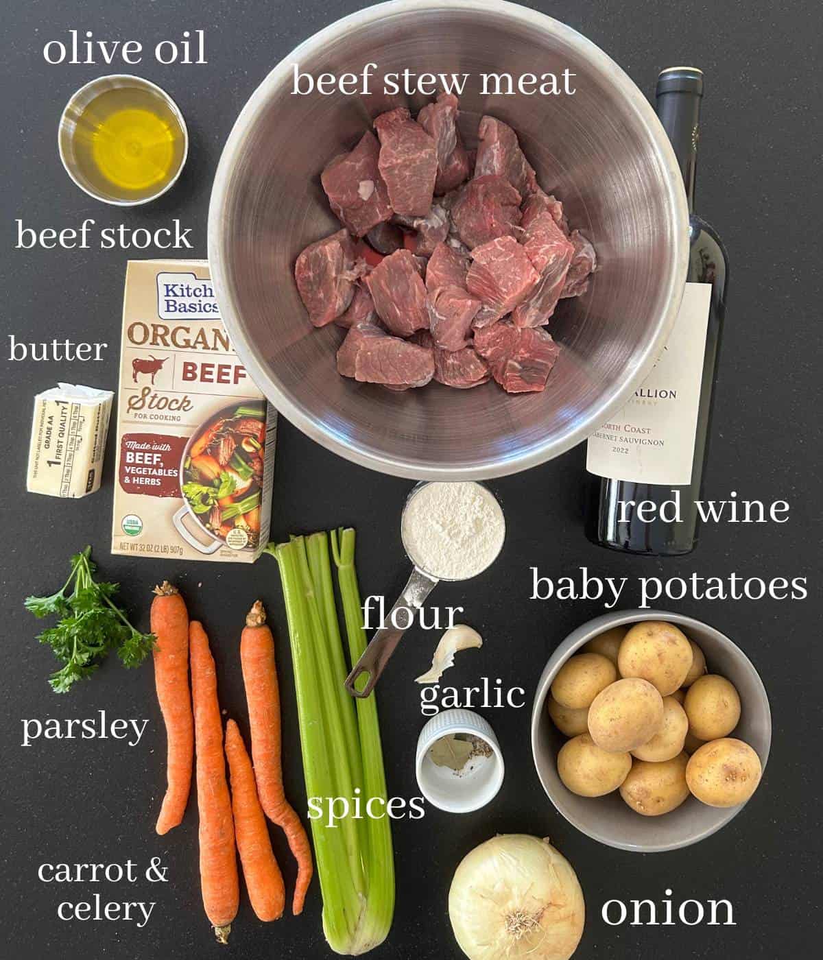 Ingredients for beef stew on counter.