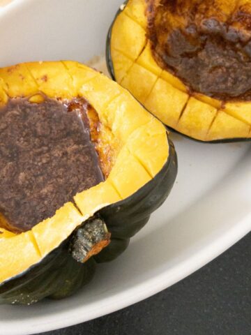 acorn squash cut in half filled with brown sugar butter