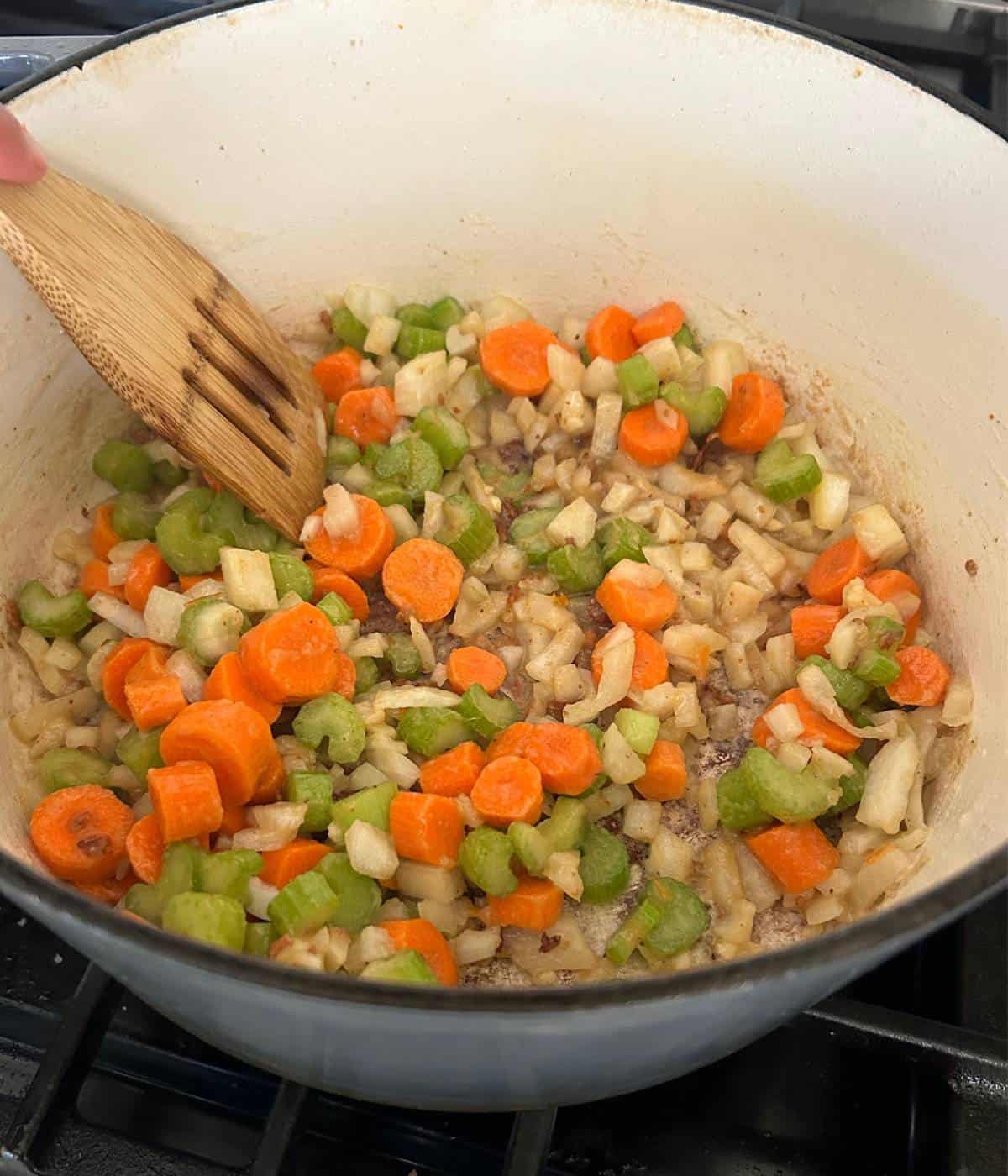 Carrot, celery, onion and garlic in roux in dutch oven.