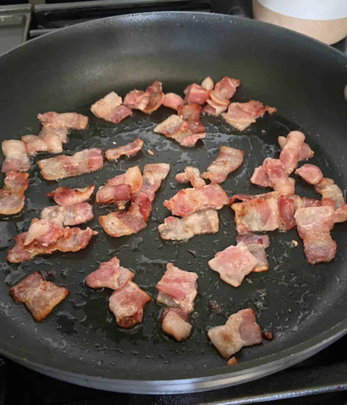 Bacon frying in pan.