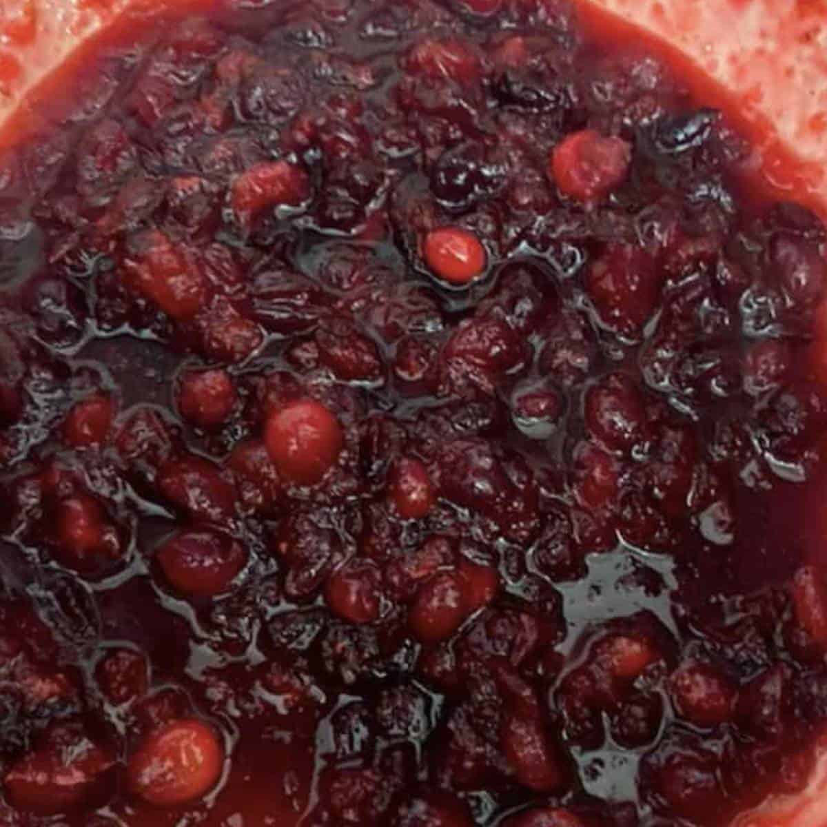 Cranberries fully cooked in dutch oven.