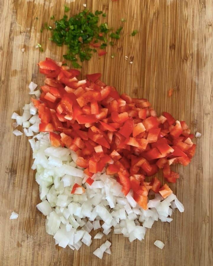 peppers, onions, jalapeños diced and minced on cutting board