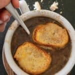 french onion soup topped with bread and melted cheese