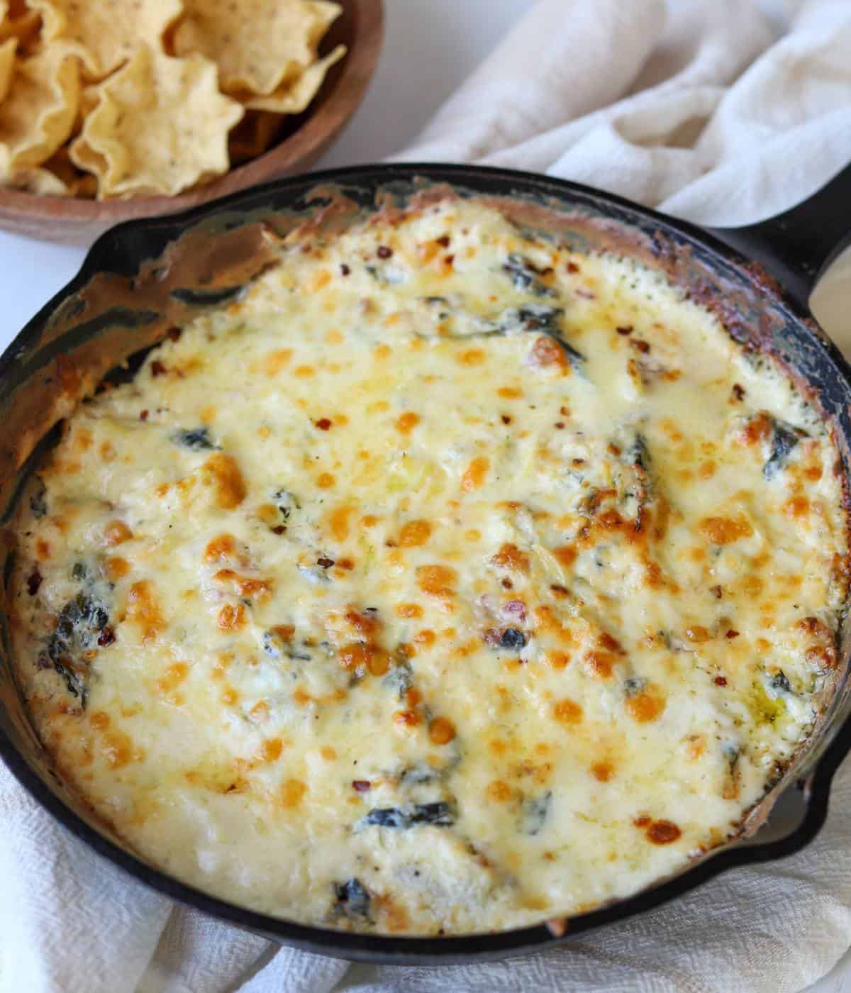 Spinach artichoke dip with no mayo in skillet. 