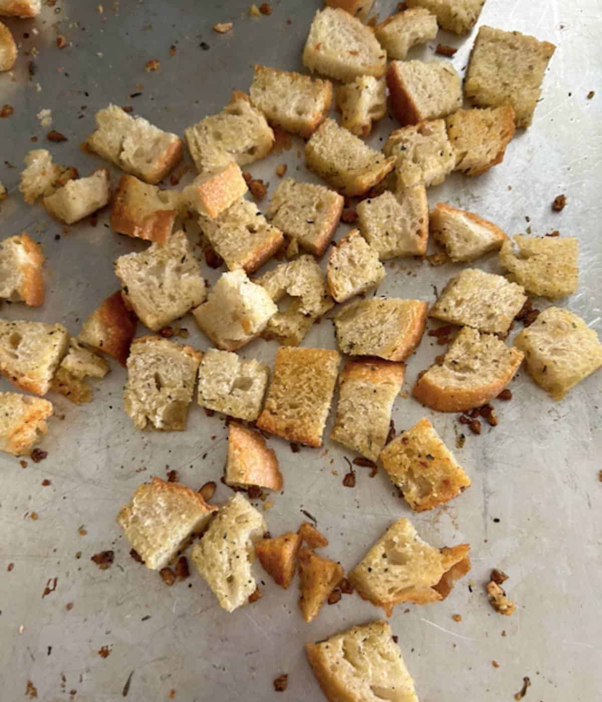Toasted soup croutons on cookie sheet after baking.