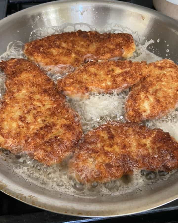 chicken fritta cutlets frying in oil