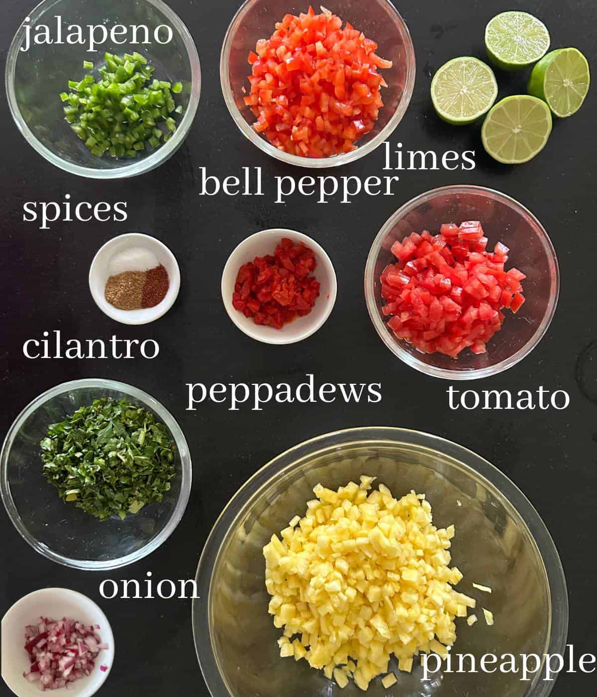 Ingredients for pineapple pico de gallo on countertop.