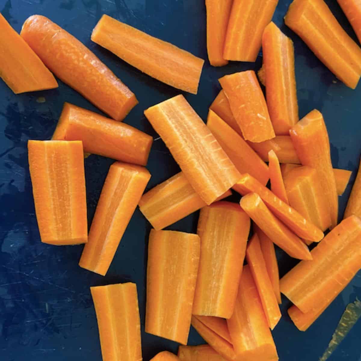 carrots cut into pieces on cutting board