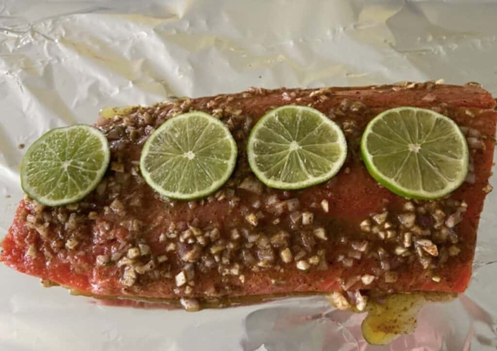 sockeye salmon pre-baked with chili lime salmon with lime slices