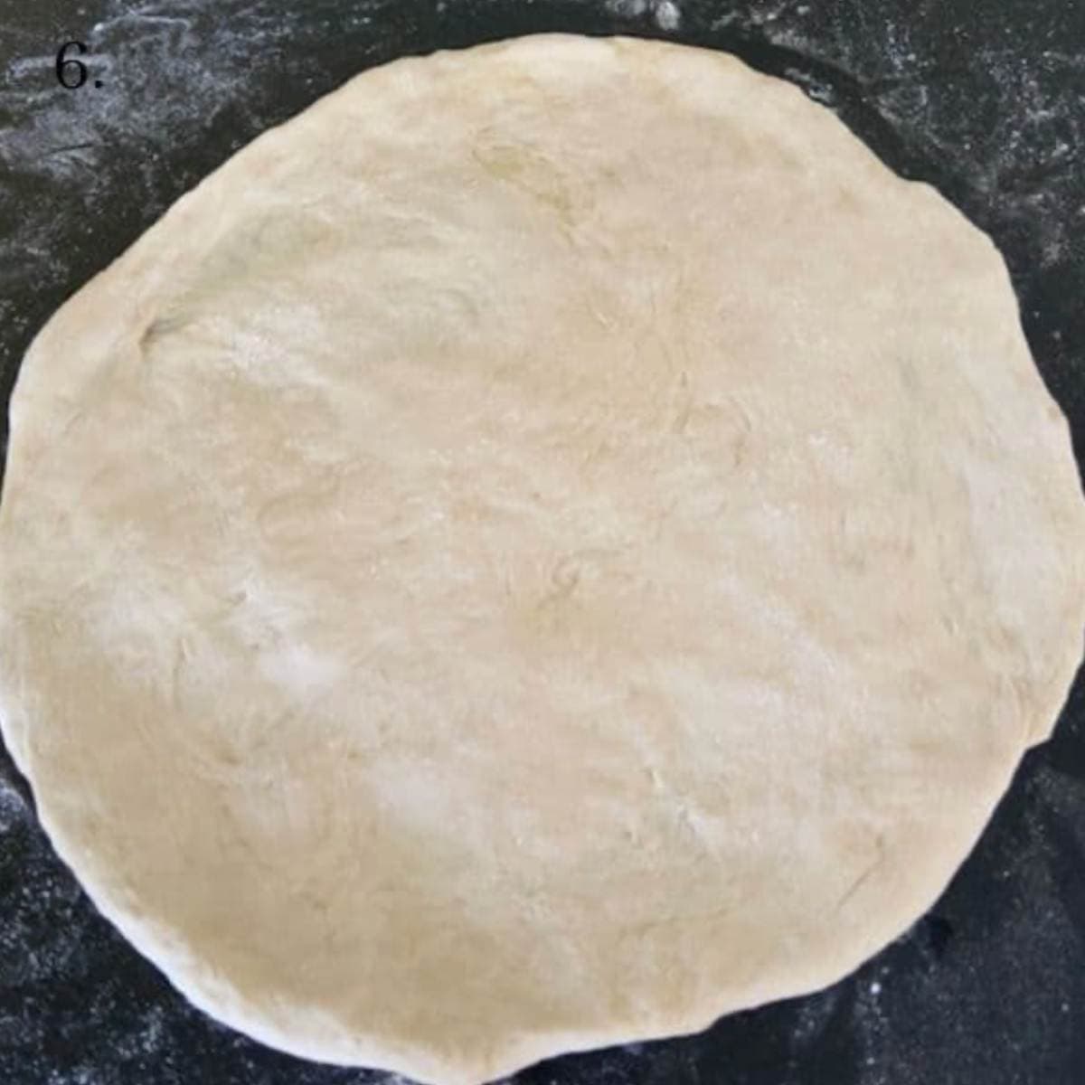 Rolled out pizza dough.