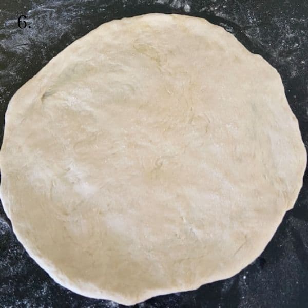 pizza dough stretched into pie shape