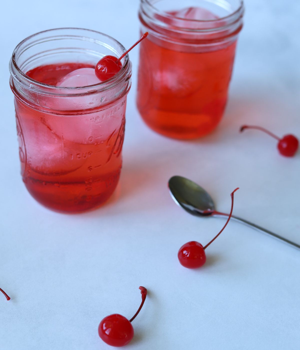overhead view of dirty shirley temple drinks in glass mason jar