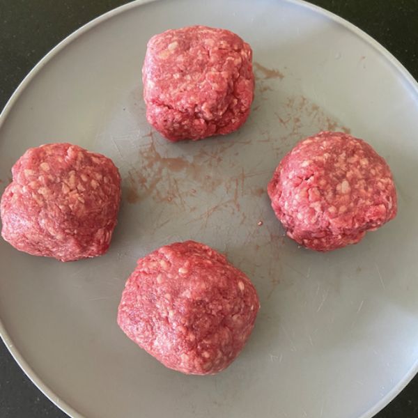 ground beef rolled into smash burgers