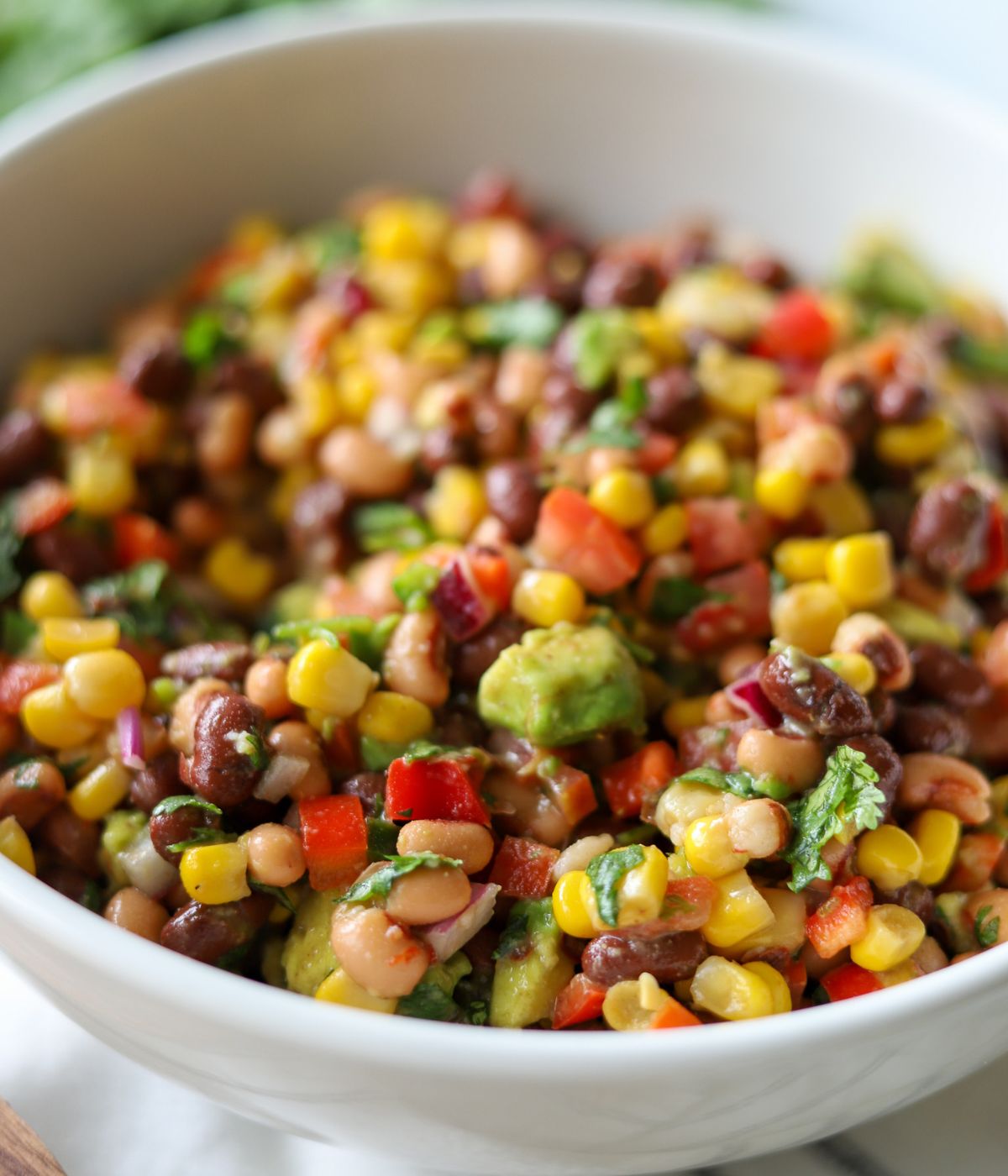 up close view of texas cowboy caviar in white bowl