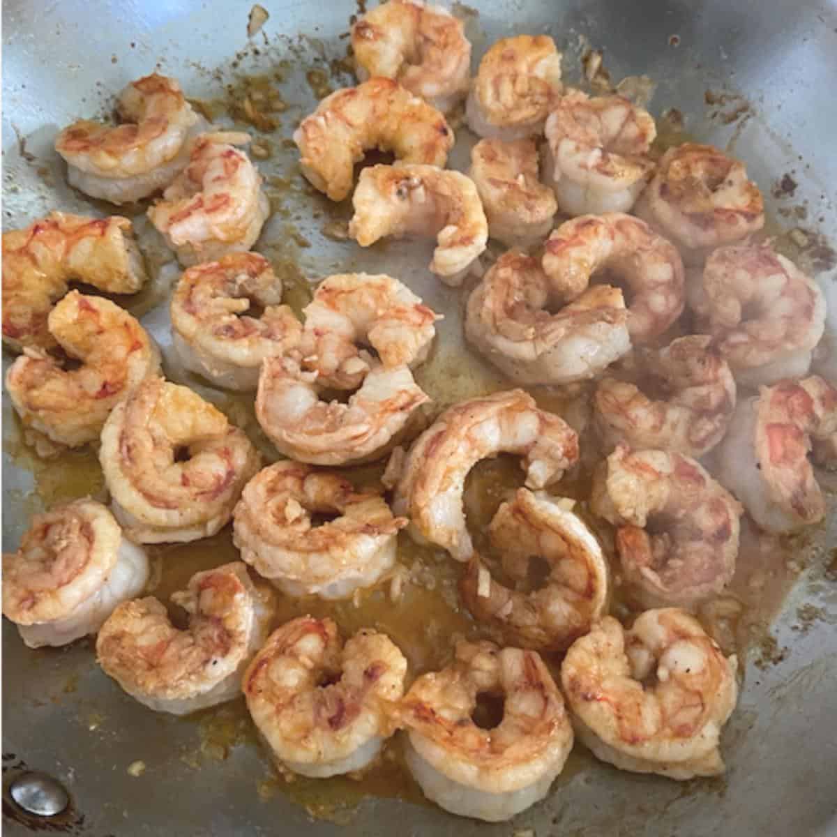 shrimp flipped over and searing on other side