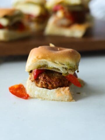 one turkey burger slider with roasted red peppers