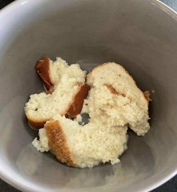 bread and milk mixture in steel bowl