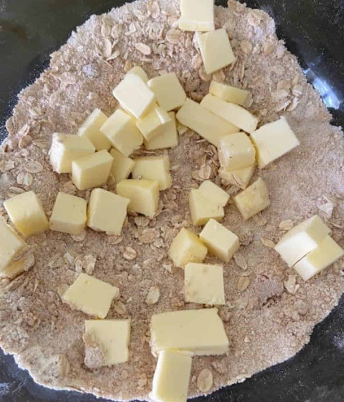 Butter added to crumble ingredients.