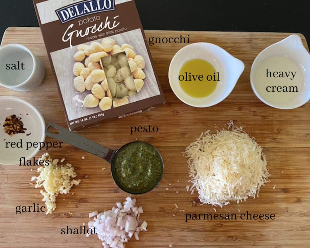 pesto gnocchi ingredients on cutting board with text