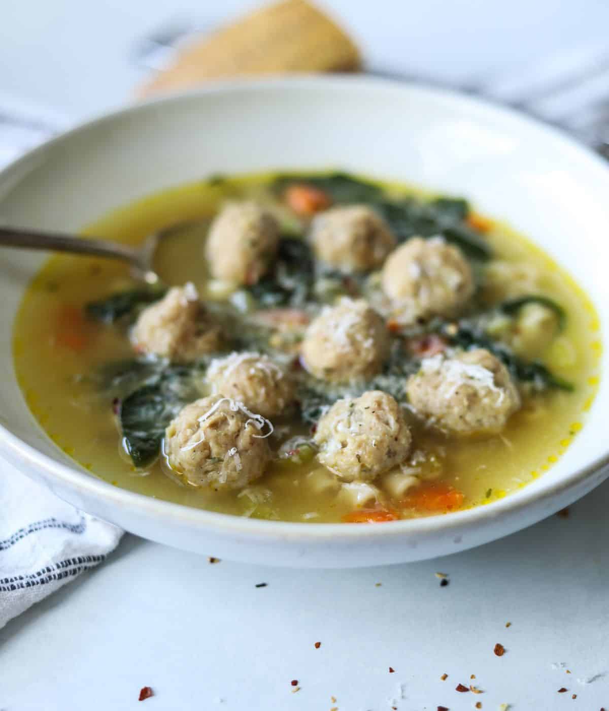 italian wedding soup in bowl with spoon