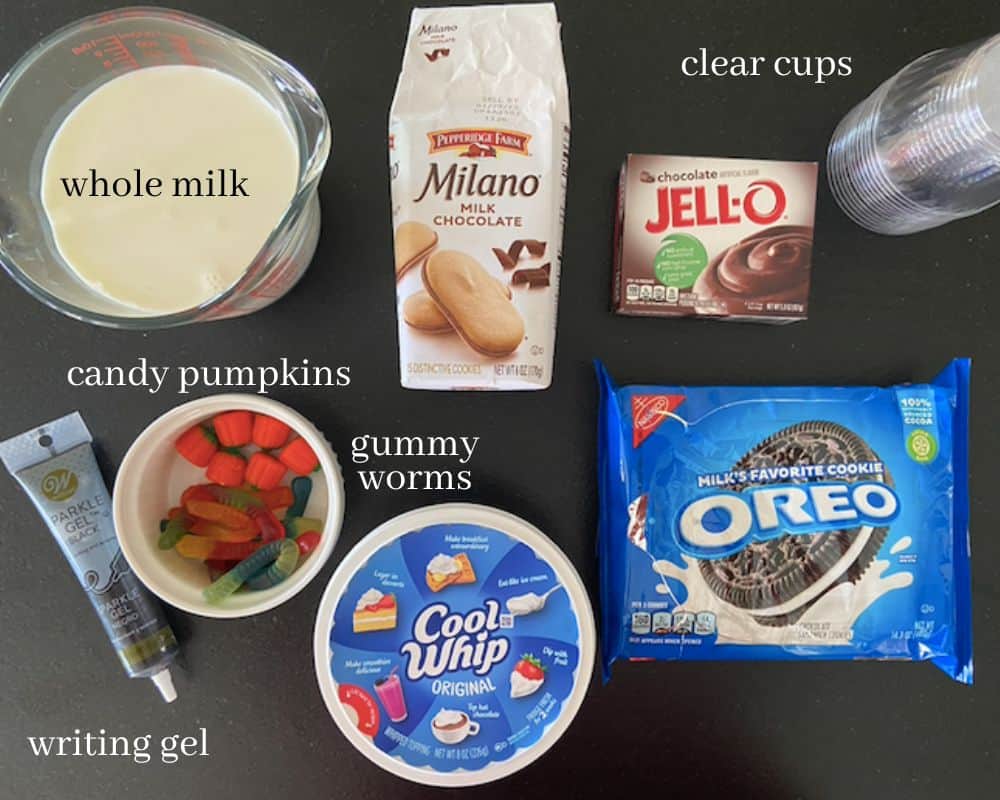 ingredients for halloween graveyard dirt pudding cups on countertop with text