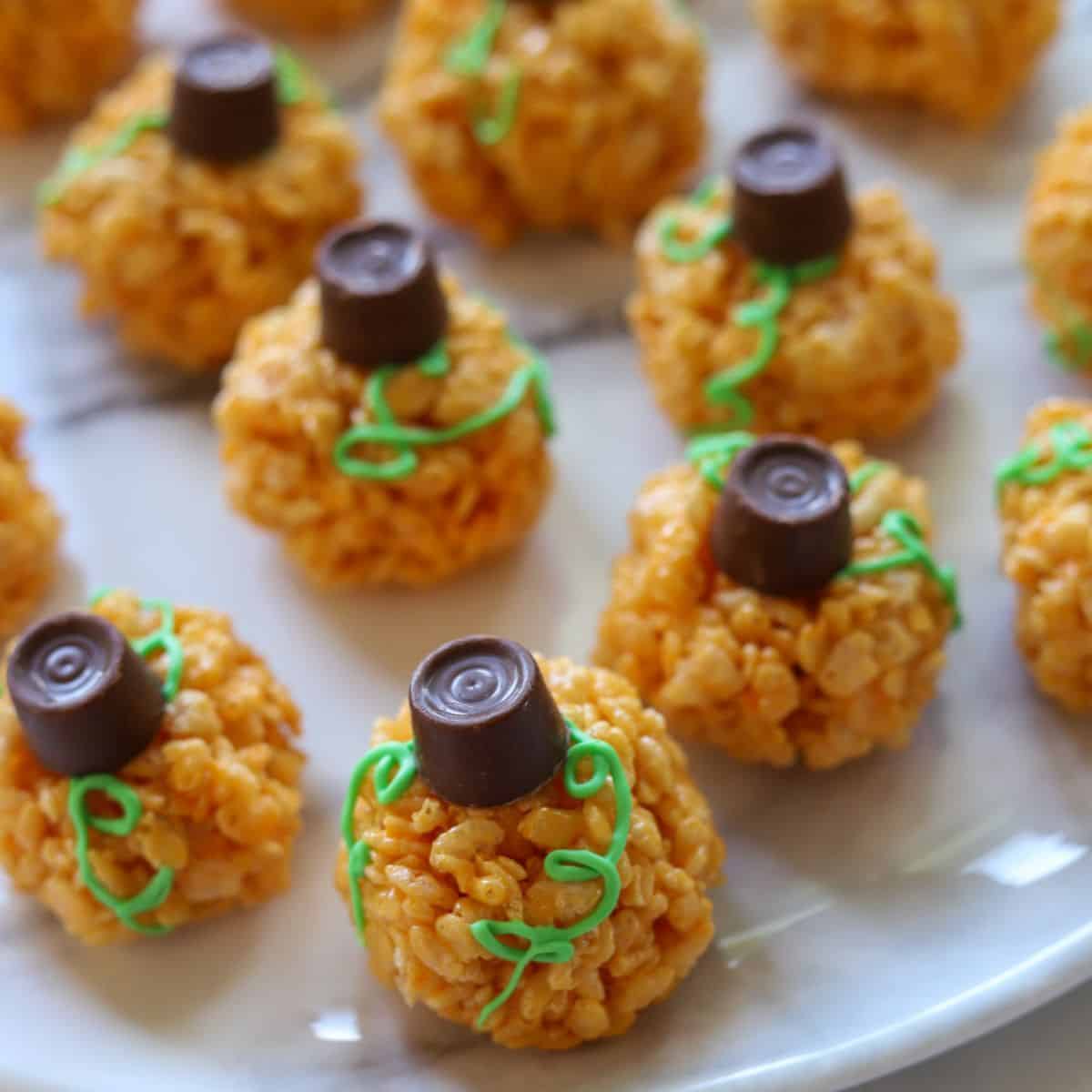 top view of several decorated pumpkin rice krispie treats