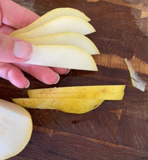 hand holding fanned pears