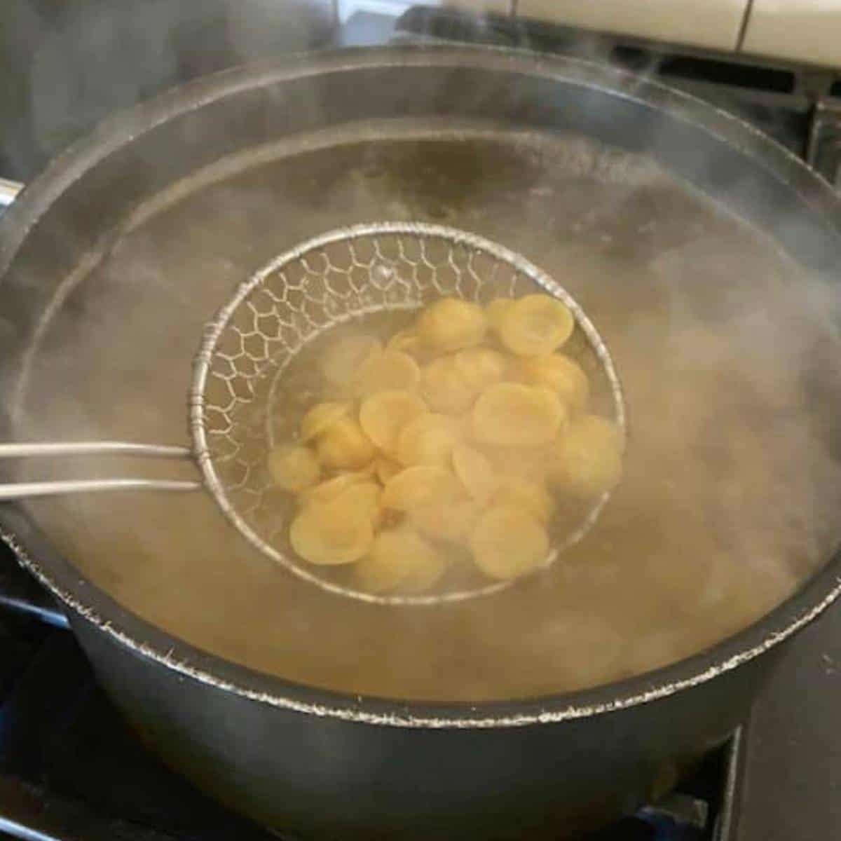 Pasta boiling in pot.