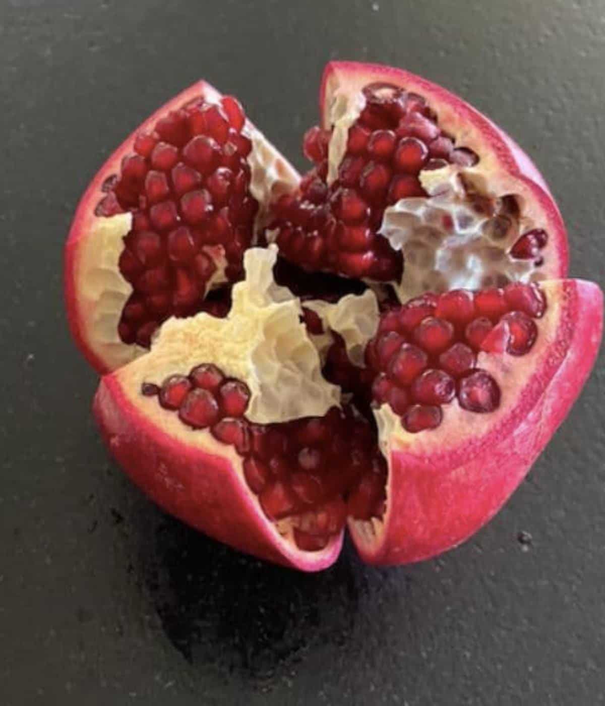 Pomegranate pulled open.