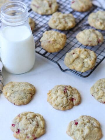 cookies on baking rack with glass of milk