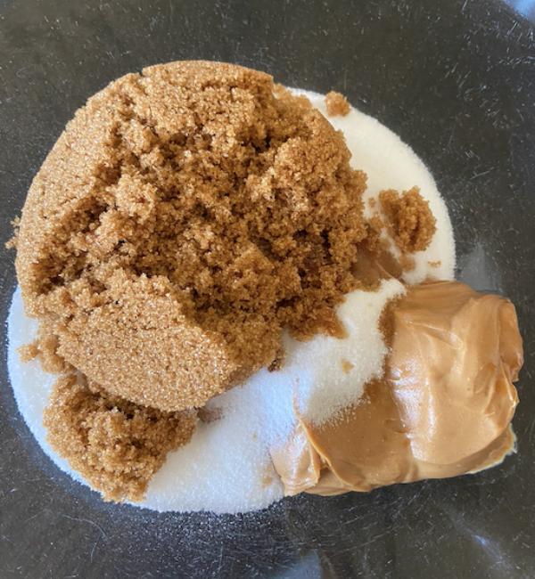 peanut butter cookie ingredients in glass bowl