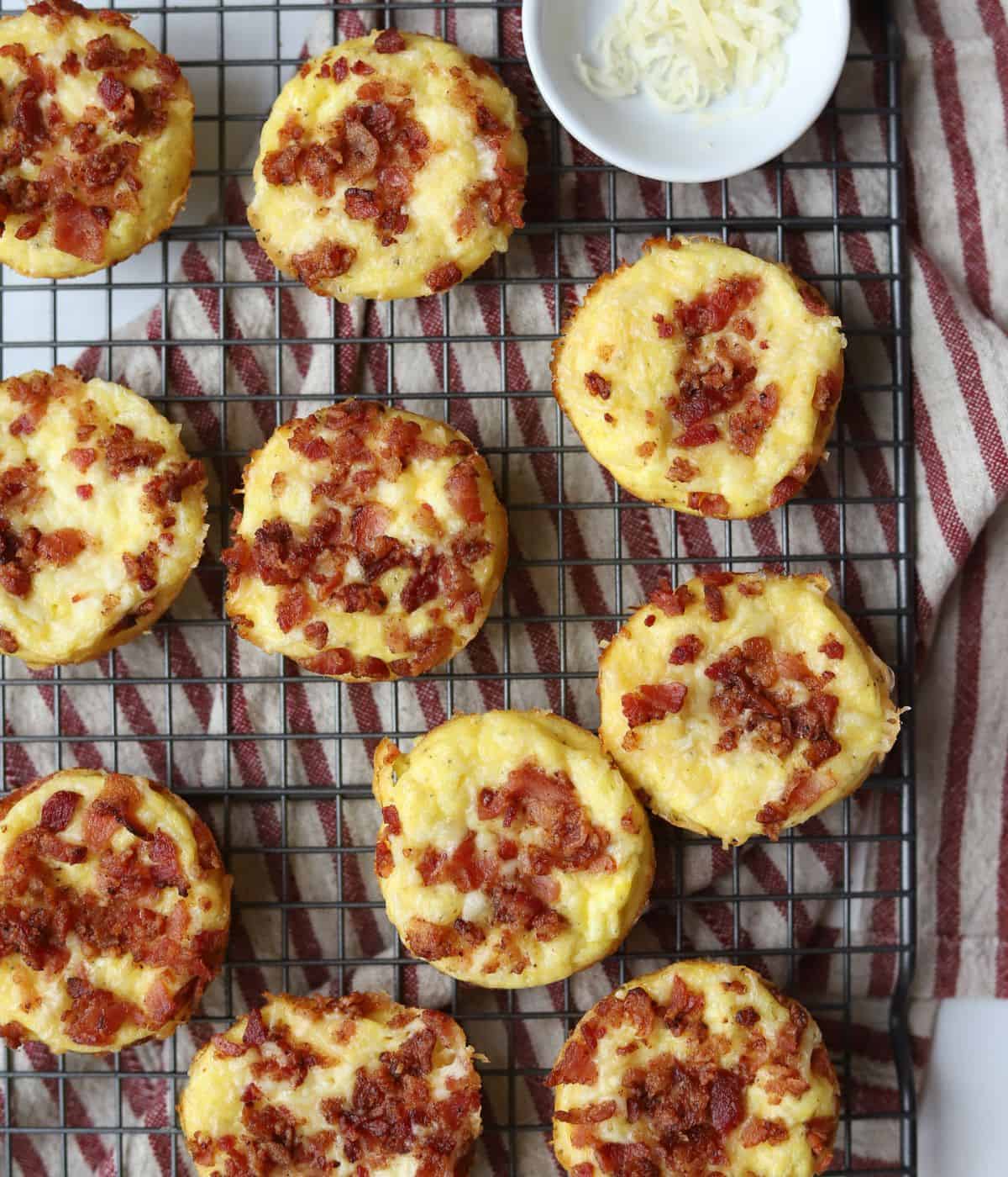 egg bites with bacon and cheese on baking rack