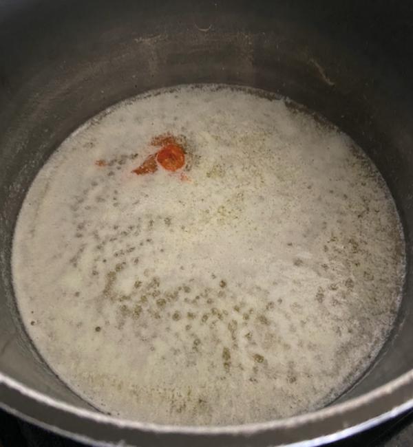 melted butter and hot sauce in a saucepan