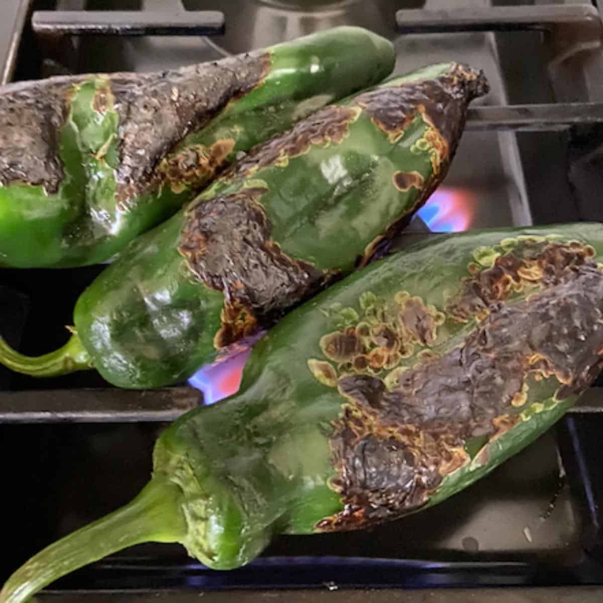 poblanos roasting over open flame
