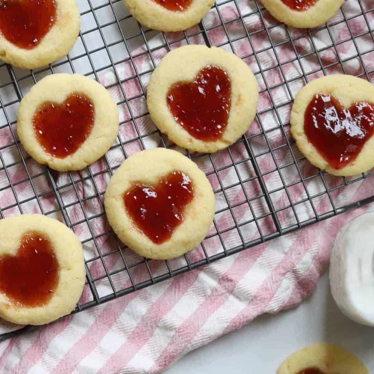 Heart jam cookie recipe on baking rack. 