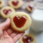hand holding heart thumbprint cookie