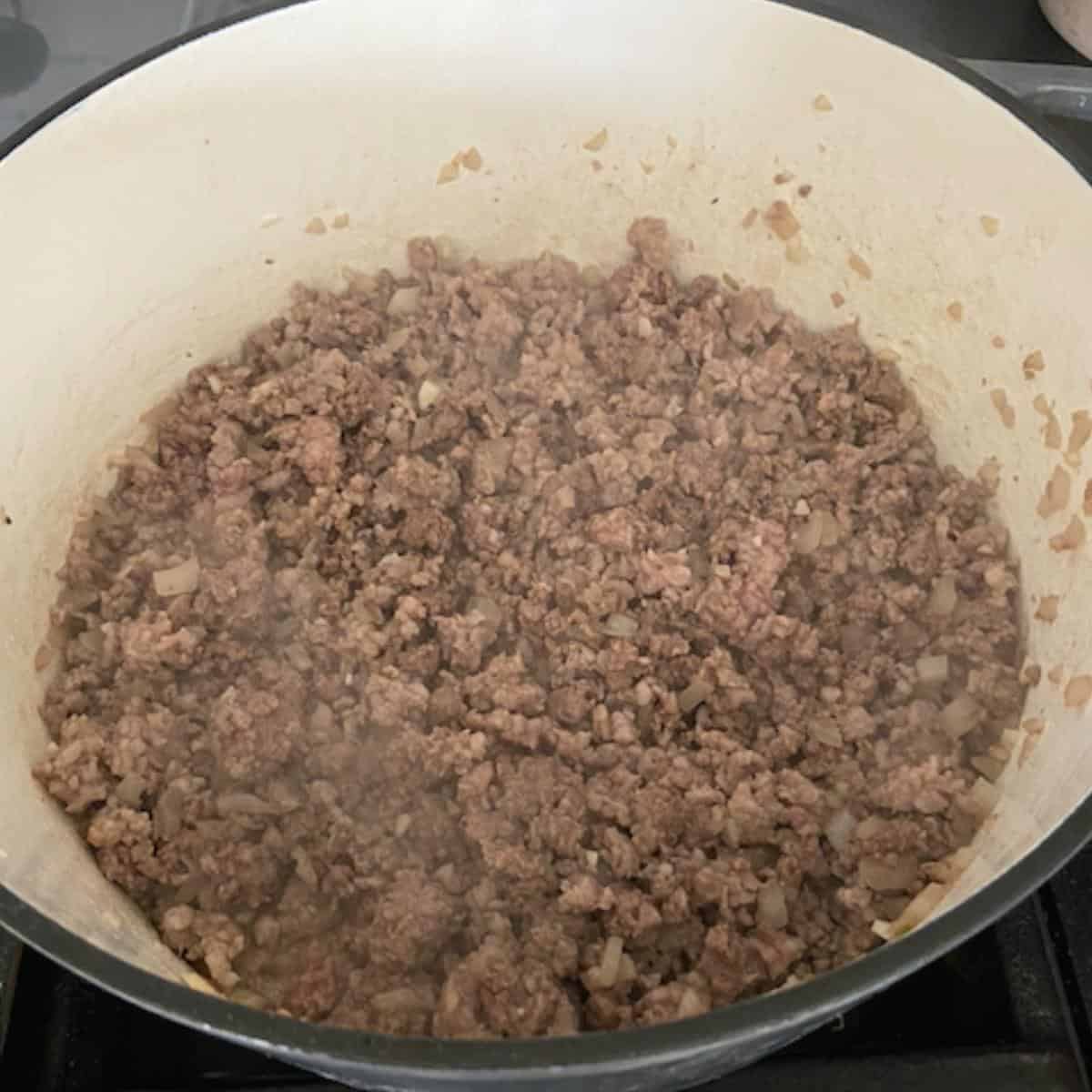 meat cooked until brown and broken up in dutch oven