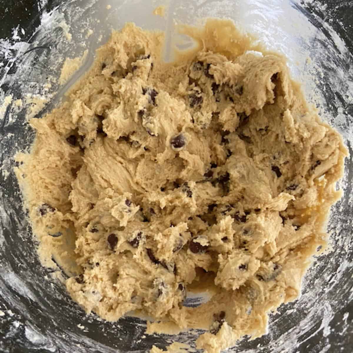 cookie dough with chocolate chips in glass bowl