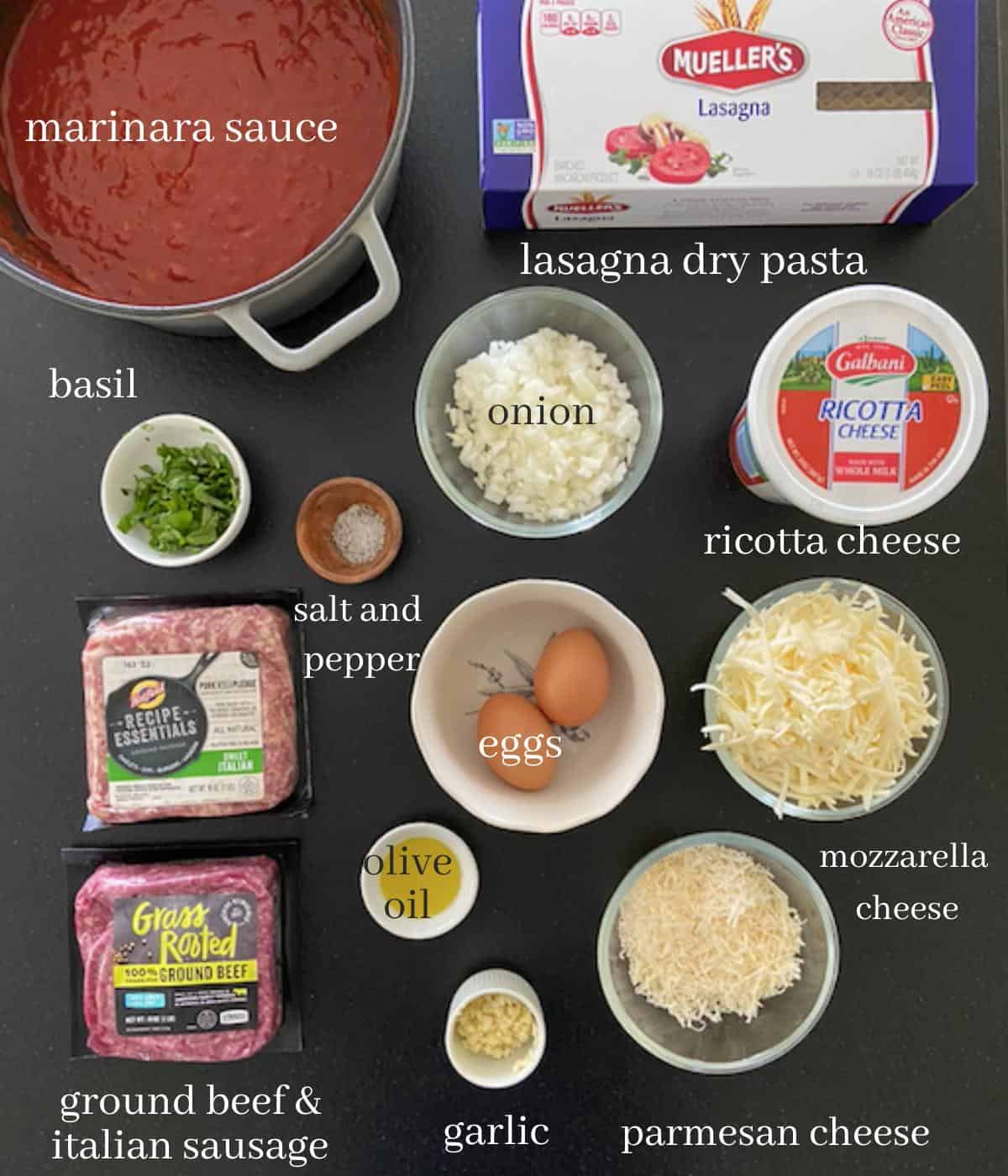 ingredients for lasagna on black countertop