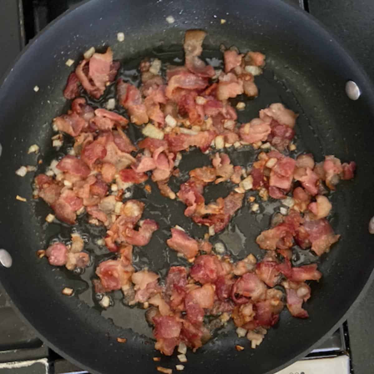 crispy bacon and onion in skillet