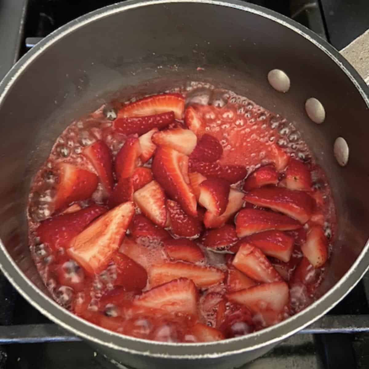 compote coming to a boil in saucepan