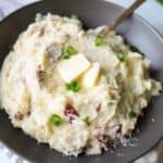 close up of red skin mashed potatoes with butter on top