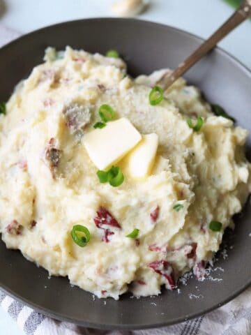 close up of red skin mashed potatoes with butter on top