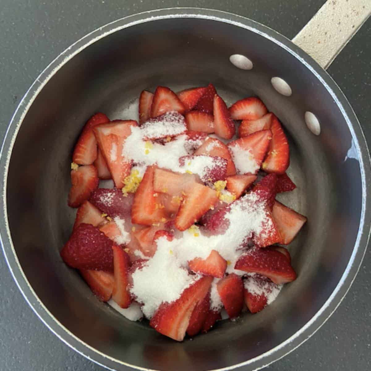 strawberry compote ingredients in saucepan